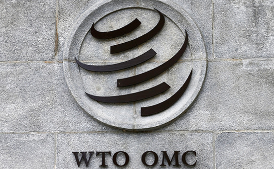 Эмблема ​Всемирной торговой организации на штаб-квартире в Женеве


