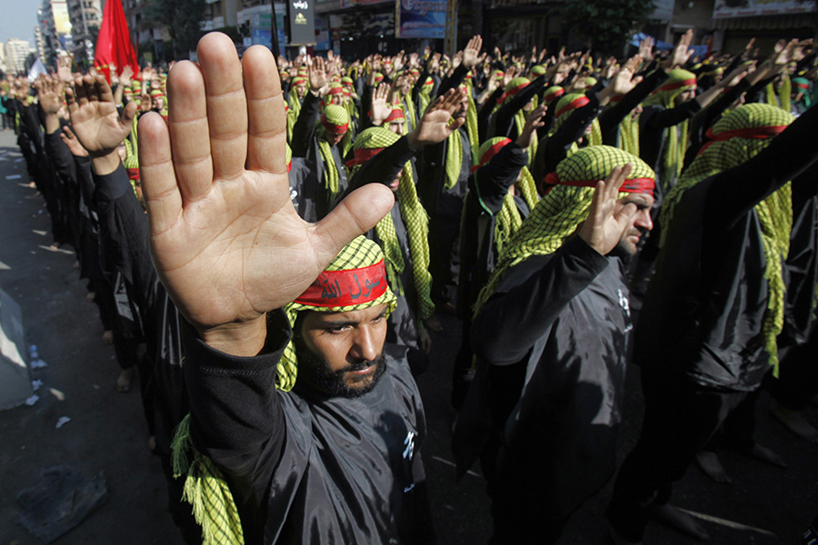 Акция ​сторонников организации «Хезболла» в пригороде Бейрута. 14 ноября 2013 года


