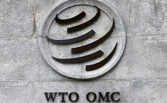 Эмблема&nbsp;​Всемирной торговой организации на штаб-квартире в Женеве


