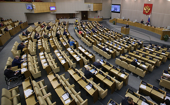 На фото пленарное заседание Госдумы РФ 26 сентября 2014 года, на котором был принят закон об ограничении иностранного капитала в СМИ