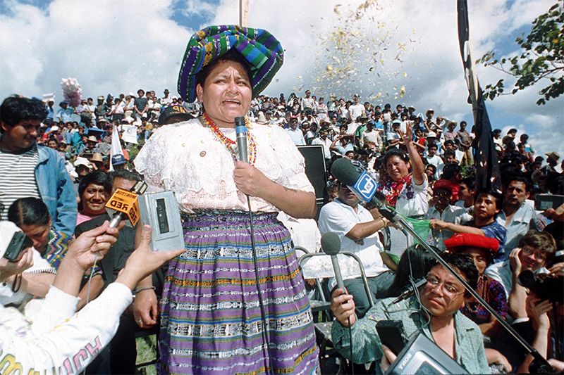 Правозащитница из Гватемалы, Менчу прославилась за счет публикации своей неоднозначной автобиографии, которая помогла ей в 33 года стать самым молодым лауреатом Нобелевской премии мира.

Менчу &ndash; представительница народа киче группы майя. В своей книге &laquo;Я, Ригоберта Менчу&raquo; правозащитница описала нарушения прав человека, а также всевозможные зверства, совершенные гватемальскими войсками в ходе гражданской войны 1960-1996 годов. Спустя более 10 лет после публикации книги антрополог Дэвил Столл исследовал описанные в ней факты и пришел к выводу, что некоторые из них отчасти или полностью не соответствуют действительности.

Нобелевский комитет отклонил требования об отзыве премии в связи с фальсификацией, однако секретарь комитета, профессор Гейр Лундестад, заявил, что врученная премия была основана не только на автобиографии Менчу. В официальном заявлении комитета говорится, что премия вручена за &laquo;заслуги в восстановлении социальной справедливости и этнокультурное примирение, основанные на уважении к правам коренного населения&raquo;.
