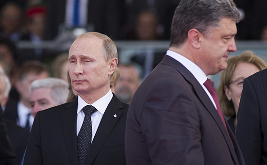 Президент России Владимир Путин (слева) и избранный президент Украины Петр Порошенко. Архивное фото