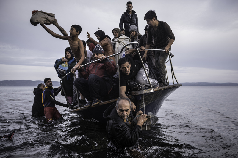 Sergey Ponomarev. Migrants arrive by a Turkish boat near the village of Skala, Россия