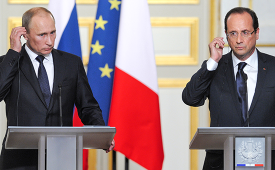 Президент России Владимир Путин (слева) и президент Франции Франсуа Олланд (справа). Архивное фото