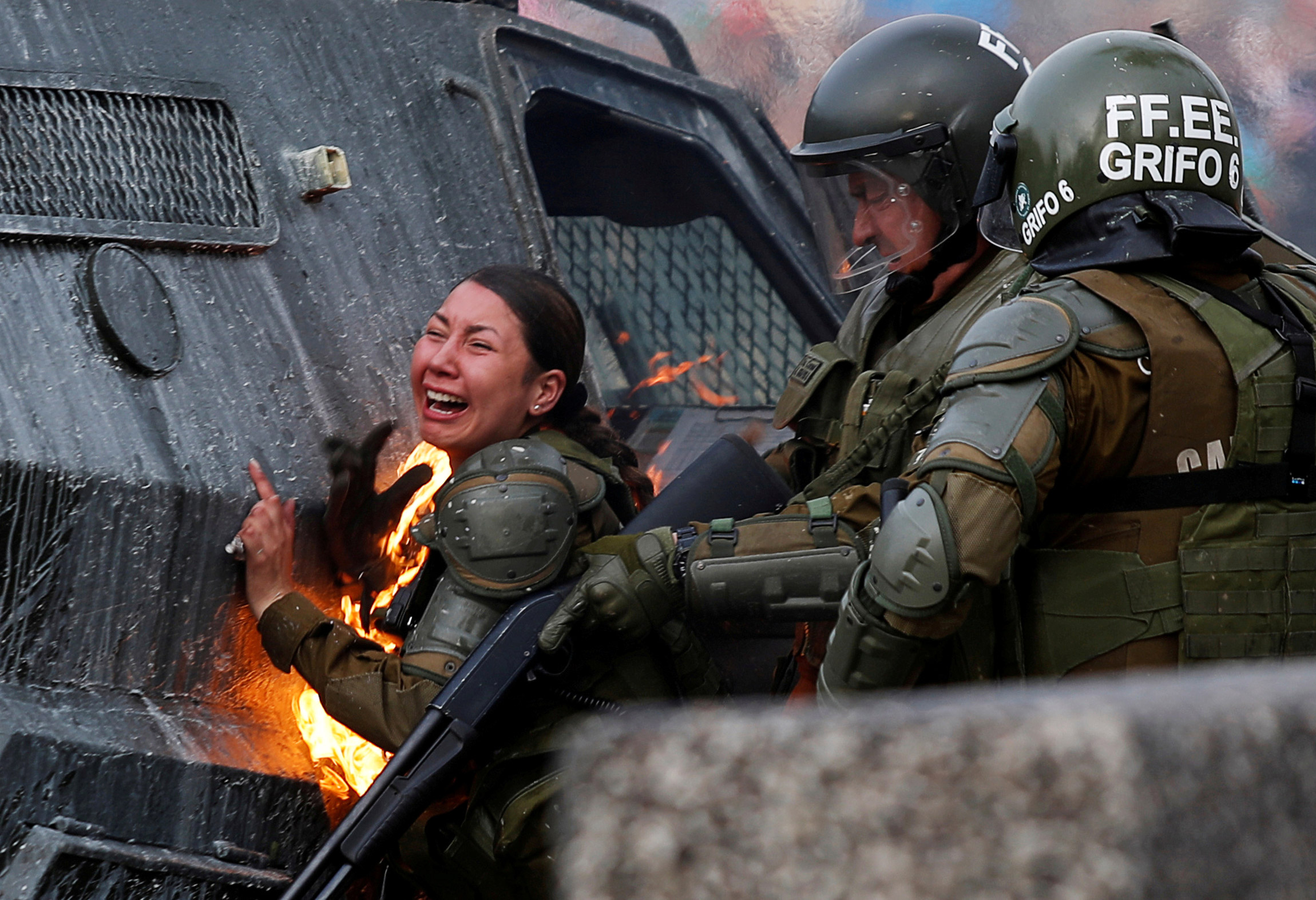 4 ноября, Сантьяго, Чили. Сотрудники спецназа во время антиправительственной акции протеста​
