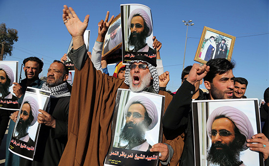 Протестующие шииты с портретами казненного проповедника Нимра аль-Нимра, Багдад, Ирак, 4 января 2016 год