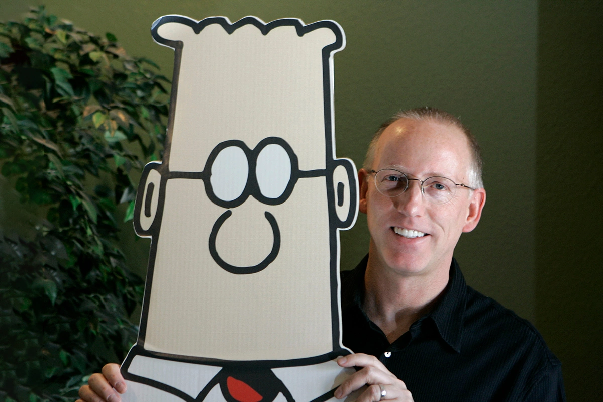 Скотт Адамс с героем из сатирического комикса «Дилберт»