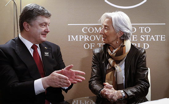Президент Украины Петр Порошенко и глава МВФ Кристин Лагард во время встречи в рамках 45-го Всемирного экономического форума. Архивное фото