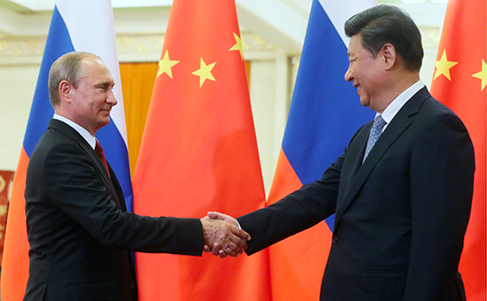Президент РФ Владимир Путин и&nbsp;председатель КНР Си Цзиньпин во&nbsp;время встречи в&nbsp;Пекине, сентябрь 2015 года

