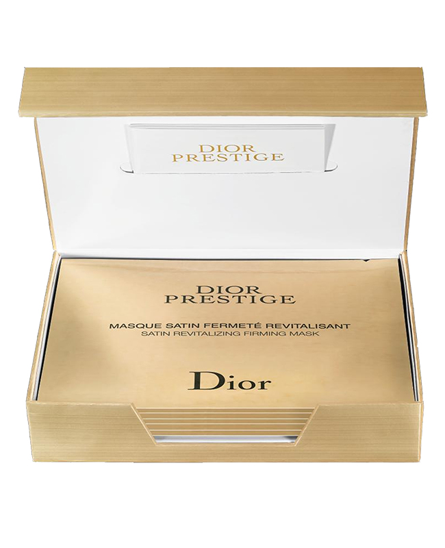 Золоченая коробка с масками Dior Prestige, Dior похожа на ларец с сокровищами:&nbsp;тканевая поверхность напоминает атласную вуаль, которая точно соответствует всем изгибам лица, а сама &laquo;пропитка&raquo; с экстрактом гранвильской&nbsp;розы эффективно восстанавливает, омолаживает и укрепляет кожу.

