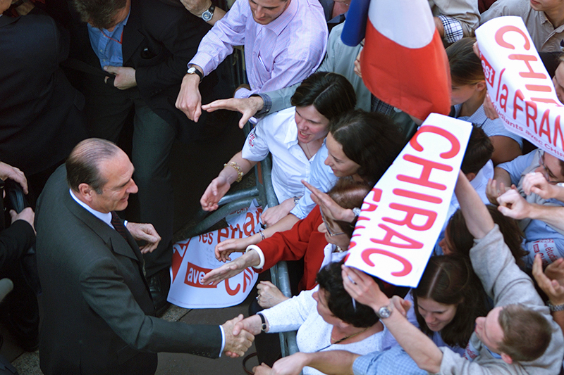 Несмотря на многочисленные скандалы, в том числе вызванные возобновлением Францией ядерных испытаний на атолле Муруроа в Тихом океане, в 2002 году Ширак был переизбран на второй президентский срок. Его соперником был лидер &laquo;Национального фронта&raquo; Жан-Мари Ле Пен. После того как все левые партии, кроме Партии рабочей борьбы Арлетт Лагийе, призвали своих сторонников проголосовать за Ширака под лозунгом &laquo;За вора, но не за фашиста&raquo;, рейтинг Ширака, получившего в первом туре лишь 20%, поднялся до 82% во втором. Тем не менее во время всего президентского срока рейтинг Ширака не превышал 35%.
14 июля 2002 года на политика было совершено покушение. Президент не пострадал, нападавший оказался членом ультраправой группировки