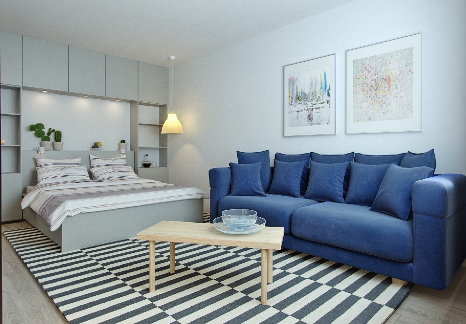 Интерьер квартиры получился сдержанным: нейтральный фон разбавляют яркие цветовые акценты, например, диван глубокого синего цвета