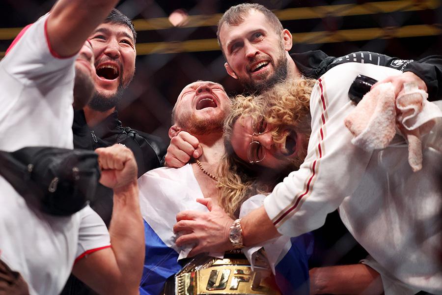 UFC 323: Dvalishvili v Yan 2
LAS VEGAS, NEVADA - DECEMBER 06: Petr Yan celebrates with his team after defeating Merab Dvalishvili of Georgia by unanimous decision in a bantamweight title bout during UFC 323 at T-Mobile Arena on December 06, 2025 in Las Vegas, Nevada.