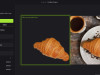 Нейросеть Flair AI сгенерировала продуктовую фотографию по тексту &laquo;croissant on a white ceramic plate, with a cup of coffee&raquo;.