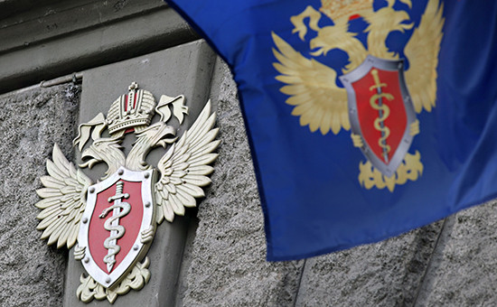 Герб ФСКН на здании ведомства