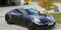 Компания Porsche приступила к дорожным испытаниям нового 911 . Фотослайдер 0