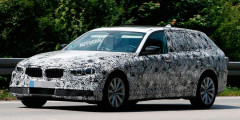 Новый универсал BMW 5-Series Touring впервые замечен на тестах. Фотослайдер 0