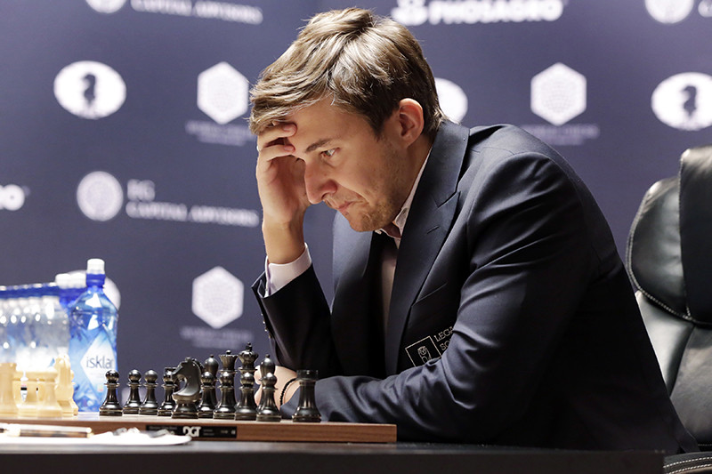 Сергей Карякин, ​Sergey Karjakin studies the board during round 8 of the World Chess Championship against Magnus Carlsen, in New York, Monday, Nov. 21, 2016


