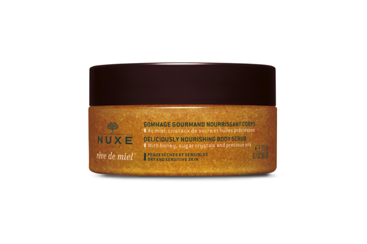 Нежный питательный скраб для тела Rêve de miel nourishing body scrub, Nuxe включает в себя кристаллы сахара, мед и растительные масла подсолнечника, арганы и огуречника, масло ши и рисовый порошок